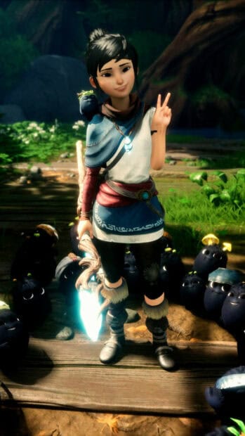 Kena Bridge Of Spirits character stands with a glowing staff surrounded by small black creatures in a forest, HD Mobile Wallpaper