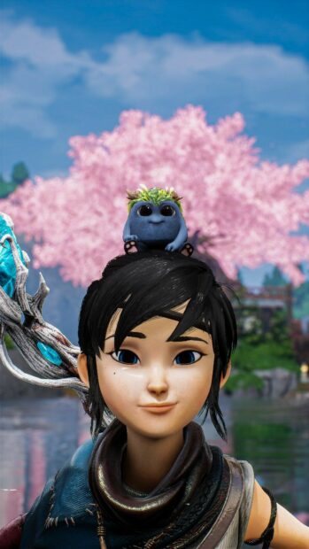 Kena stands with a small forest spirit resting on her head near pink cherry blossoms, HD Phone Wallpaper