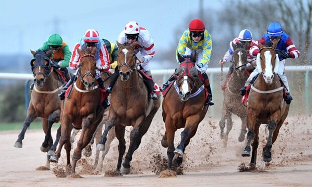 Jockeys compete in a Kentucky Derby horse race on a dirt track, HD Desktop Wallpaper