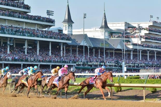 Jockeys compete in the Kentucky Derby race surrounded by a large crowd, HD Desktop Wallpaper