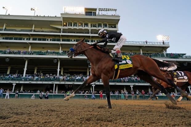 A jockey rides a racehorse near the finish line at the Kentucky Derby event, HD Desktop Wallpaper