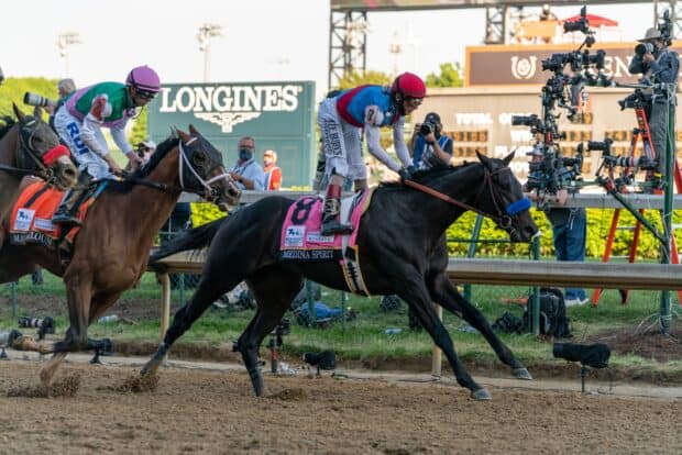 A jockey rides a black horse in a Kentucky Derby horse race, HD Desktop Wallpaper