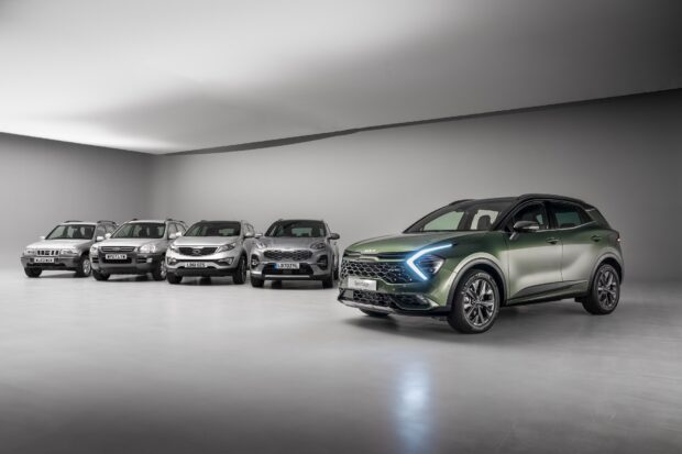 A lineup of Kia car models is displayed in a studio showing the evolution of designs, HD Desktop Wallpaper