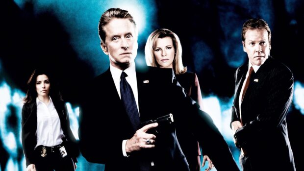 The image shows Kim Basinger and co stars in intense expressions holding a gun, HD Desktop Wallpaper