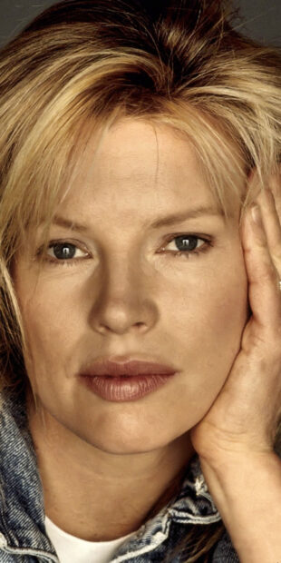 A close up portrait of Kim Basinger with hand on face and thoughtful expression, HD Phone Wallpaper