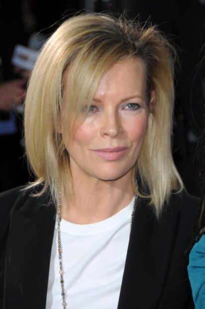 Kim Basinger looks directly at the camera with a calm expression, HD Mobile Wallpaper