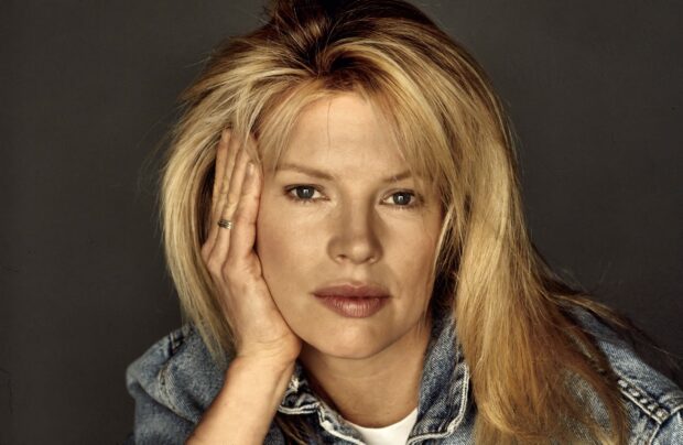 Kim Basinger wallpapers shows a close up portrait with her hand on the face, 2K Desktop Wallpaper