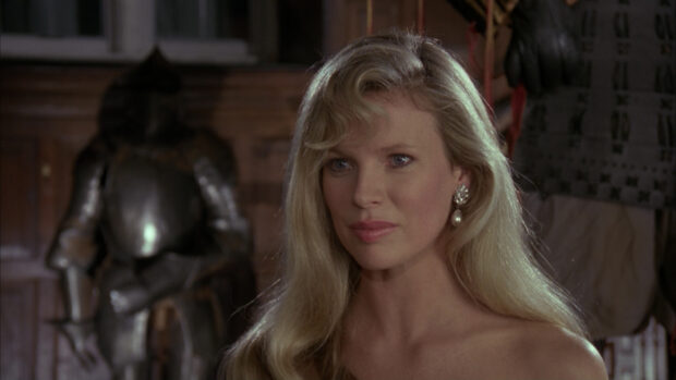 Kim Basinger is shown with long blonde hair and pearl earrings indoors, HD Desktop Wallpaper