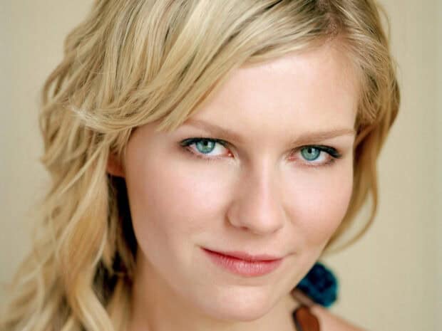 Kirsten Dunst is shown with green eyes and blonde hair in a close up portrait, HD Desktop Wallpaper