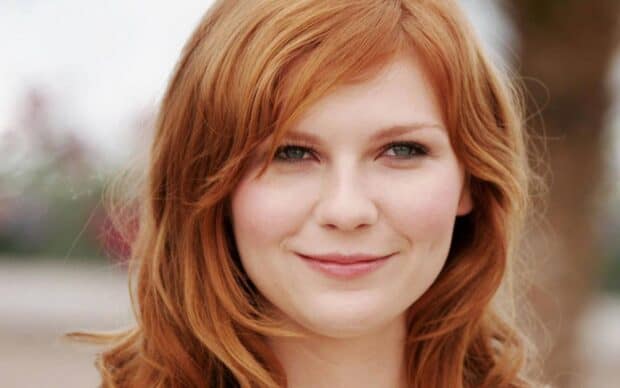 A close up portrait of Kirsten Dunst smiling gently outdoors, HD Desktop Wallpaper
