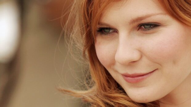 A close up portrait of Kirsten Dunst with red hair and subtle smile, HD Desktop Wallpaper