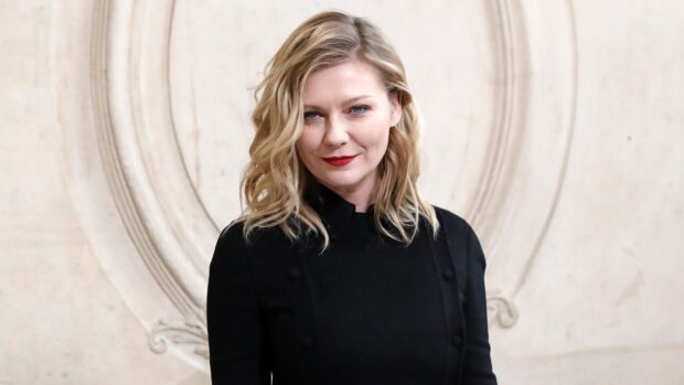Kirsten Dunst wallpapers features her wearing a black outfit with a light background, 4K Desktop Wallpaper