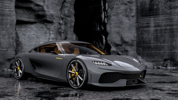 A gray Koenigsegg sports car is parked in front of a rocky wall with reflective ground, 4K Desktop Wallpaper