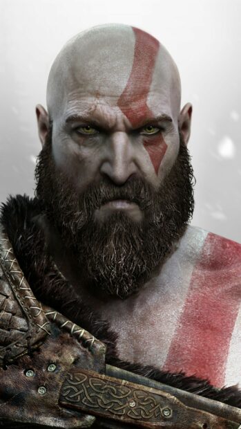 Kratos is shown with a red mark on his face and intense yellow eyes in God Of War Ragnarok Wallpapers, 2K Phone Wallpaper