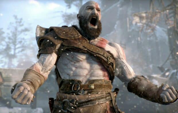 Kratos is shown shouting fiercely with clenched fists in a snowy environment from God Of War Ragnarok, HD Desktop Wallpaper