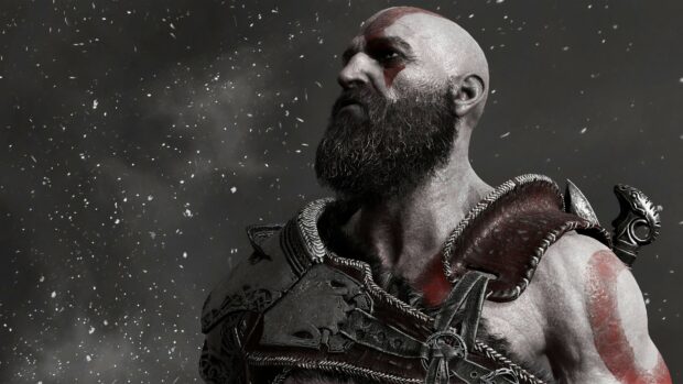 Kratos is shown with war paint and armor in a snowy environment, 4K Desktop Wallpaper
