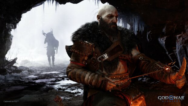 Kratos is preparing his bow with focused attention in a dark cave with a shadowy figure in the background, 4K Desktop Wallpaper