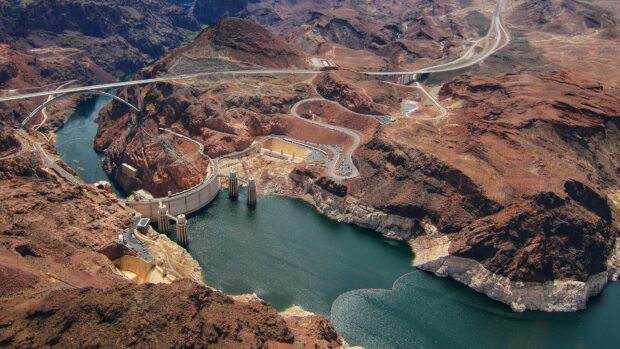 An aerial view of Lake Mead with the Hoover Dam and surrounding desert landscape, 4K Desktop Wallpaper