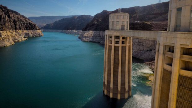Lake Mead reservoir with dam towers and surrounding mountains, 2K Desktop Wallpaper
