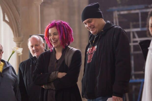 Lana Wachowski is smiling joyfully while standing with others, 2K Desktop Wallpaper