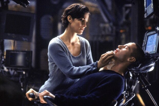 Lana Wachowski wallpapers showing a woman tending to a man in a high tech environment, HD Desktop Wallpaper