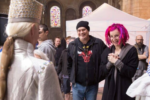 Lana Wachowski smiles warmly during a film production scene, 2K Desktop Wallpaper