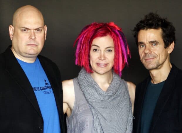 Lana Wachowski is pictured with two colleagues in a studio setting, 2K Desktop Wallpaper