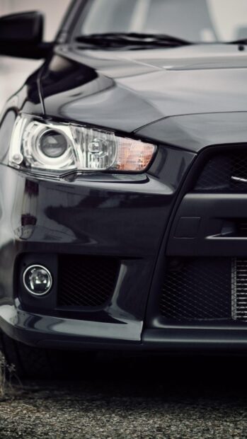 The Lancer Evo front headlight and bumper are shown in detail, HD Phone Wallpaper