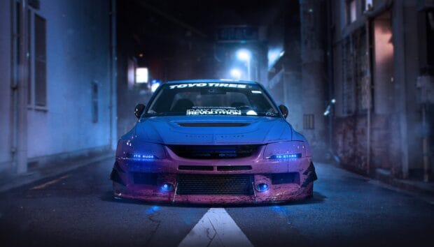 A Lancer Evo is parked on a city street with glowing blue lights, HD Desktop Wallpaper