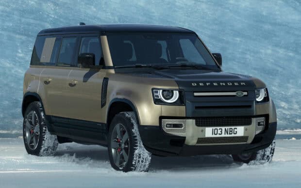 A Land Rover Defender is parked on snow covered ground with icy blue backdrop, HD Desktop Wallpaper