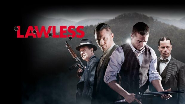 Guy Pearce stands with other characters holding guns in a tense scene, 2K Desktop Wallpaper
