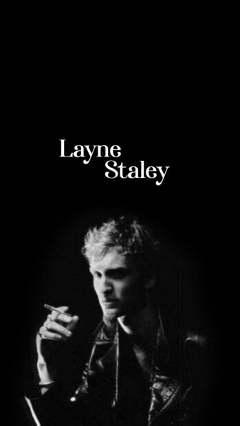 A black and white image of Layne Staley holding a cigarette wearing a leather jacket, HD Phone Wallpaper