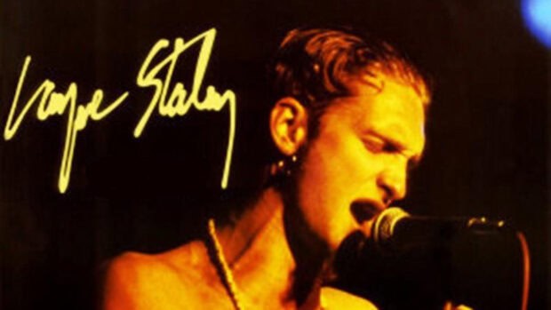 Layne Staley is passionately singing into a microphone during a live performance, 4K Desktop Wallpaper