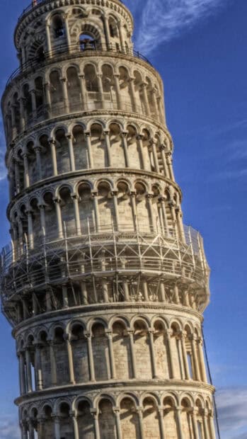 The Tower of Pisa stands with scaffolding under a clear blue sky, HD Mobile Wallpaper