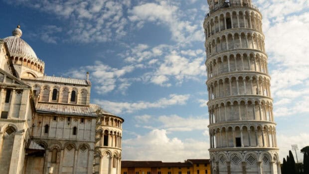The Tower of Pisa stands tall against a partly cloudy sky in Italy, HD Desktop Wallpaper