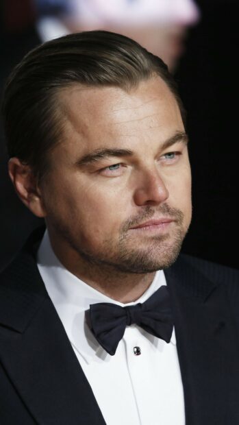 A close up portrait of Leonardo Dicaprio wearing a bow tie at a formal event, 4K Phone Wallpaper