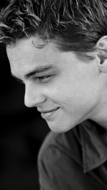A close up portrait of Leonardo Dicaprio looking down with a gentle smile, HD Phone Wallpaper