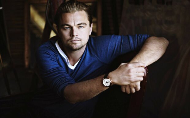 Leonardo Dicaprio Wallpapers shows a man with blue eyes wearing a blue shirt and watch, HD Desktop Wallpaper