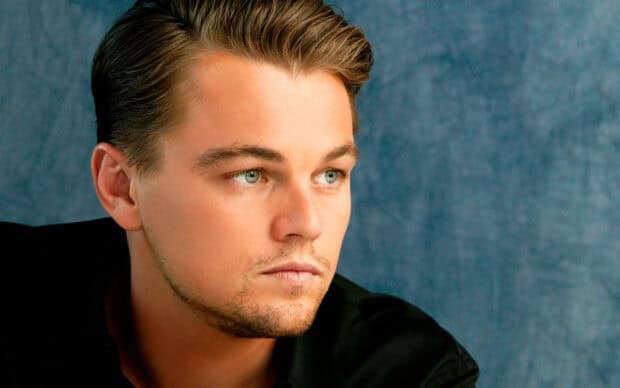 Leonardo Dicaprio with a serious expression looking away from the camera, 2K Desktop Wallpaper