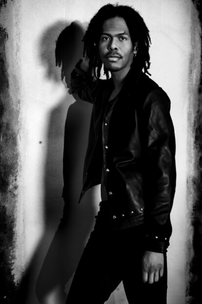 A stylish Les Twins member poses in black and white lighting, HD Desktop Wallpaper