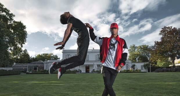 One performer jumps while the other stands, representing Les Twins Wallpapers, 2K Desktop Wallpaper