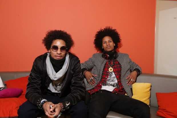 Les Twins are sitting on a couch with colorful cushions behind them, HD Desktop Wallpaper