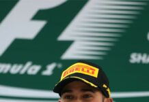Lewis Hamilton smiles holding his racing trophy after winning a Formula 1 race, HD Phone Wallpaper