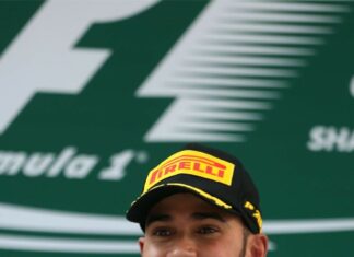 Lewis Hamilton smiles holding his racing trophy after winning a Formula 1 race, HD Phone Wallpaper
