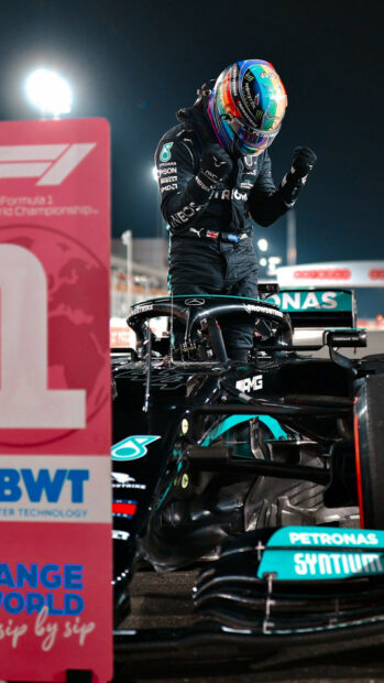 Lewis Hamilton celebrates victory next to his Formula 1 car, HD Mobile Wallpaper