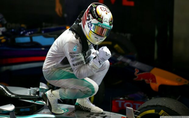 Lewis Hamilton celebrates fiercely after winning a race in his Mercedes car, 2K Desktop Wallpaper