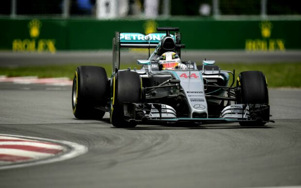 Lewis Hamilton drives a Mercedes Formula 1 car on the track, 2K Desktop Wallpaper