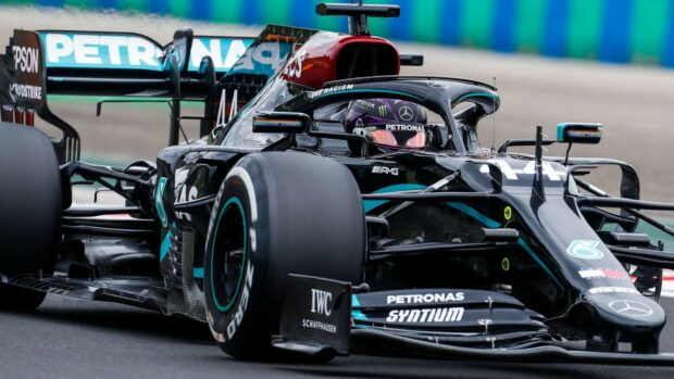 Lewis Hamilton races the Mercedes AMG Petronas on a track during a Formula One event, HD Desktop Wallpaper