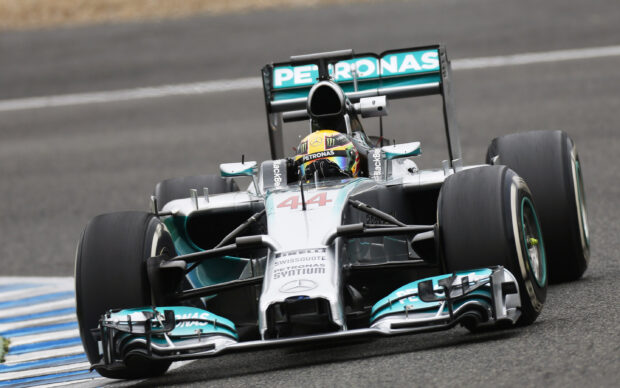 Lewis Hamilton driving a Mercedes Formula 1 car during a race event, 2K Desktop Wallpaper