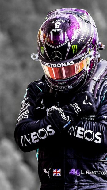 Lewis Hamilton is wearing his racing suit and helmet with sponsor logos, HD Mobile Wallpaper